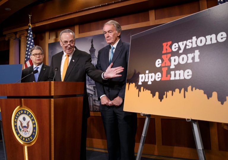 Sen. Charles Schumer, D-N.Y., center, joined by Sen. Al Franken, D-Minn., left, and Sen. Edward J. Markey, D-Mass., gestures during a news conference on Capitol Hill in Washington, Tuesday, Jan. 20, 2015, to talk about the Keystone XL Pipeline bill being debated on the Senate floor. (AP Photo/J. Scott Applewhite)