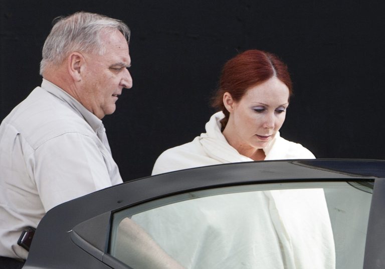 FILE - In this June, 7, 2013, file photo, Shannon Richardson is escorted to a Titus County Sheriff's car after a court appearance in Texarkana, Texas. (AP Photo/The Texarkana Gazette, Curt Youngblood, File)