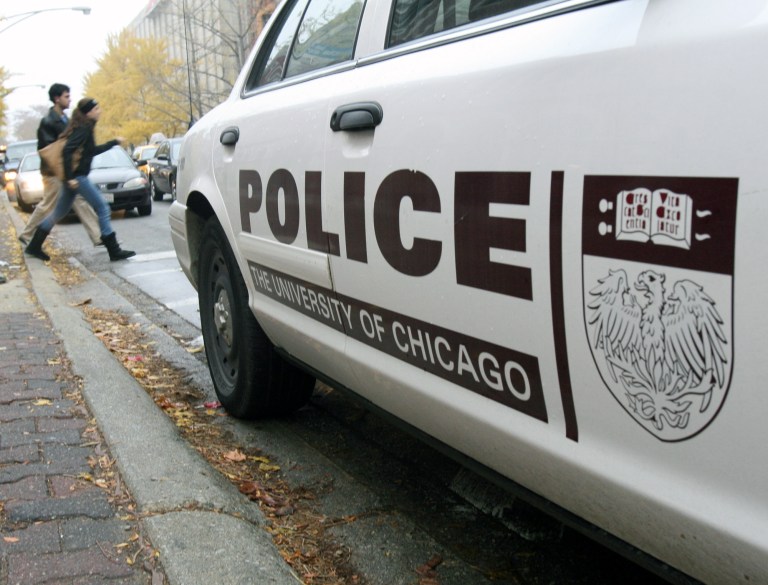 Students at University of Chicago discover the folly of abolishing the police Pedestrians walk by a University of Chicago police car parked along the street in Chicago, Tuesday, Nov. 20, 2007. (AP Photo/Stacie Freudenberg)