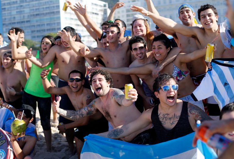 Argentina soccer fans cheer on Copacabana beach the morning of the final World Cup match between Argentina and Germany in Rio de Janeiro, Brazil, Sunday, July 13, 2014. (AP Photo/Silvia Izquierdo)