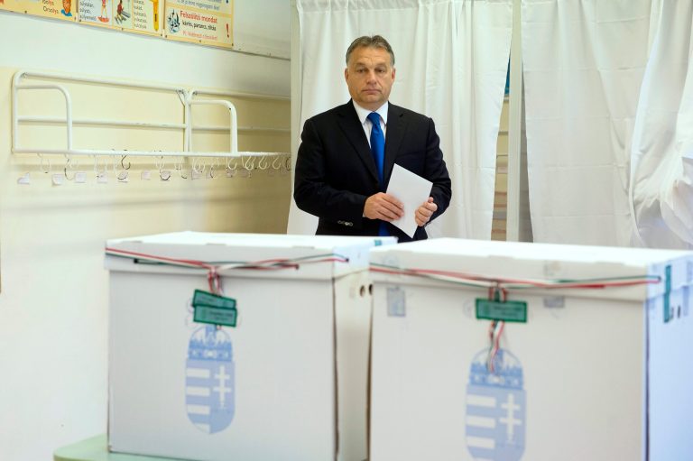 Hungarian Prime Minister and Chairman of center right Fidesz party Viktor Orban before casting his vote during municipal elections in Budapest, Hungary, Sunday, Oct. 12, 2014. (AP Photo/MTI, Szilard Koszticsak)