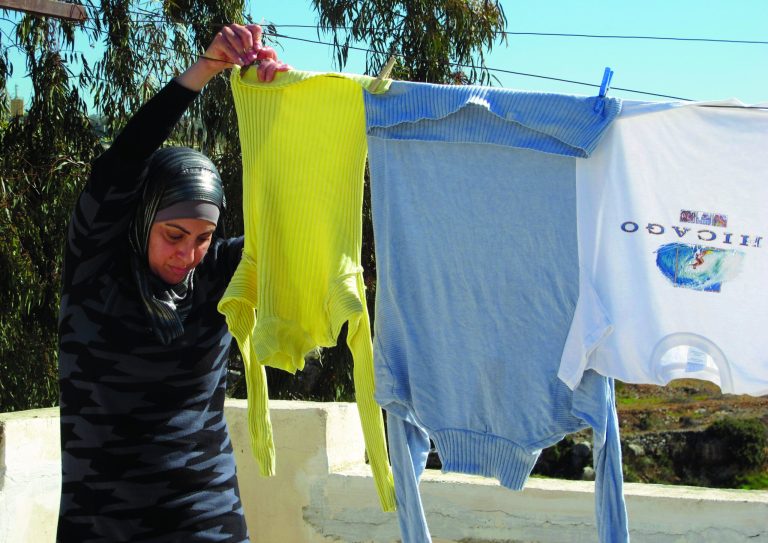 In this Sunday, Feb. 3, 2013 photo, Palestinian Suraia Burnat, 42, wife of the Palestinian co-director of 