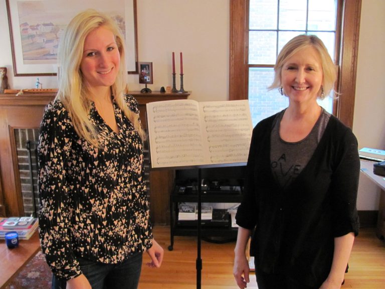 Minnesota Orchestra flutist Wendy Williams, right, and student Alyssa Griggs pose for a photo in St. Paul, Minn., on Dec. 16. (AP Photo/Minnesota Public Radio, Chris Roberts)
