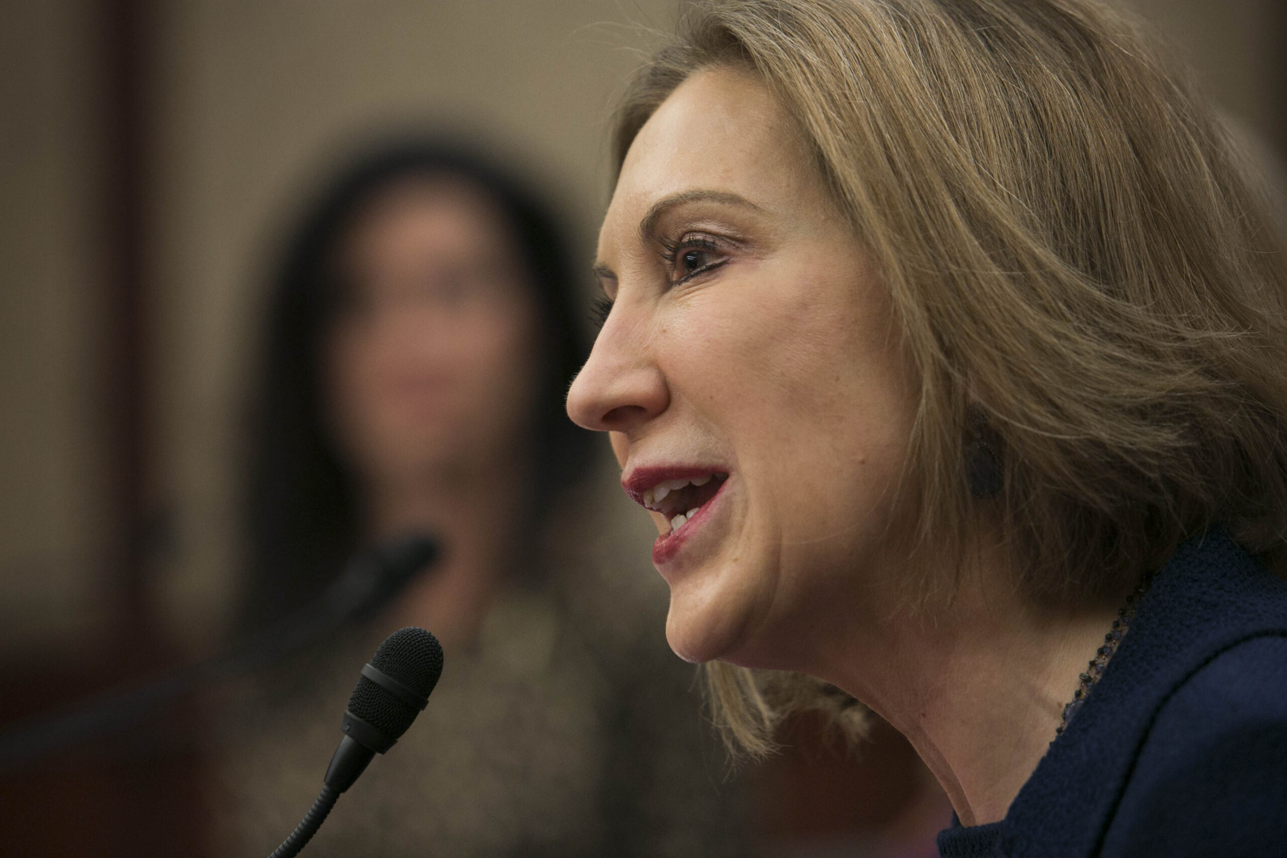 Fiorina faces grilling on Iran printer sales, layoffs