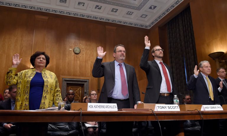 Witnesses, from left, Office of Personnel Management (OPM) Director Katherine Archuleta; OPM Chief Information Officer Tony Scott; Assistant Secretary of Office of Cybersecurity and Communications National Protection and Programs Directorate at the Department of Homeland Security Andy Ozment and OPM Inspector General Patrick E. McFarland, are sworn in on Capitol Hill in Washington. (AP Photo/Susan Walsh)