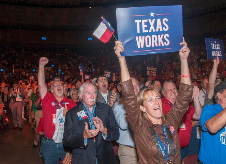 Delegates to the Texas GOP Convention cheer for Gov. Rick Perry after his speech in Fort Worth, Texas on Thursday, June, 5, 2014. In his address, the longest-serving governor in the state's history focused more on the future and national issues than his political legacy at home. (AP Photo/Rex C. Curry)