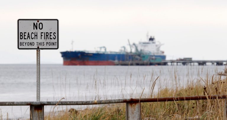   FILE - In this photo taken Oct. 23, 2012, a ship is seen in the distance moored in the Strait of Georgia near Bellingham, Wash. The U.S. trade deficit increased in October because exports fell by a larger margin than imports, a sign that slower global growth could weigh on the U.S. economy. The Commerce Department said Tuesday, Dec. 11, 2012 that the trade deficit grew 4.8 percent in October from September to $42.2 billion. (AP Photo/Elaine Thompson, File)  
