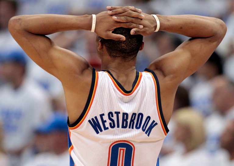   Oklahoma City Thunder point guard Russell Westbrook (0) pauses at a break against the Miami Heat during the second half at Game 2 of the NBA finals basketball series, Thursday, June 14, 2012, in Oklahoma City. (AP Photo/Jeff Roberson)  