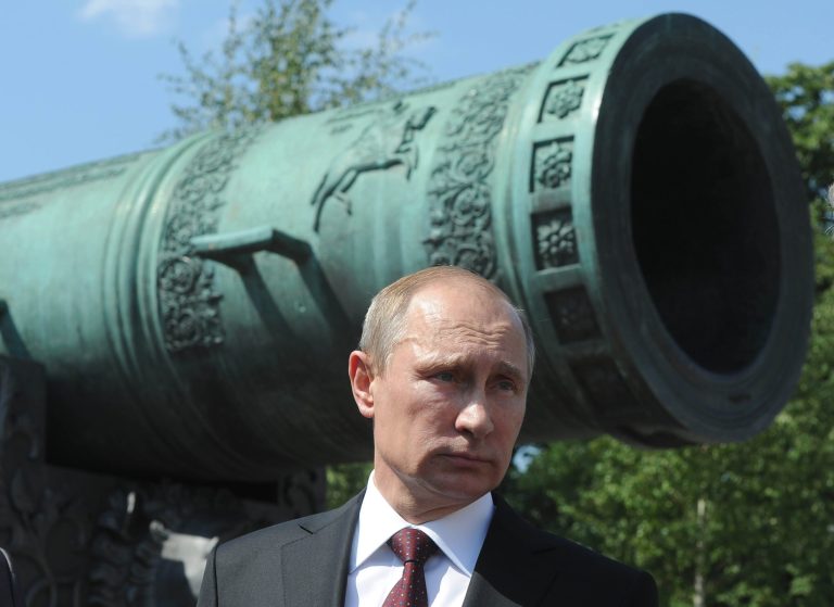 Russian President speaks during a meeting outside the Tzar Pushka ( Tzar Cannon) in Moscow's Kremlin, Russia, Thursday, July 31, 2014. Putin on Thursday presented state awards to cosmonauts, lawmakers, journalists and others. (AP Photo/RIA Novosti Kremlin, Mikhail Klimentyev, Presidential Press Service)