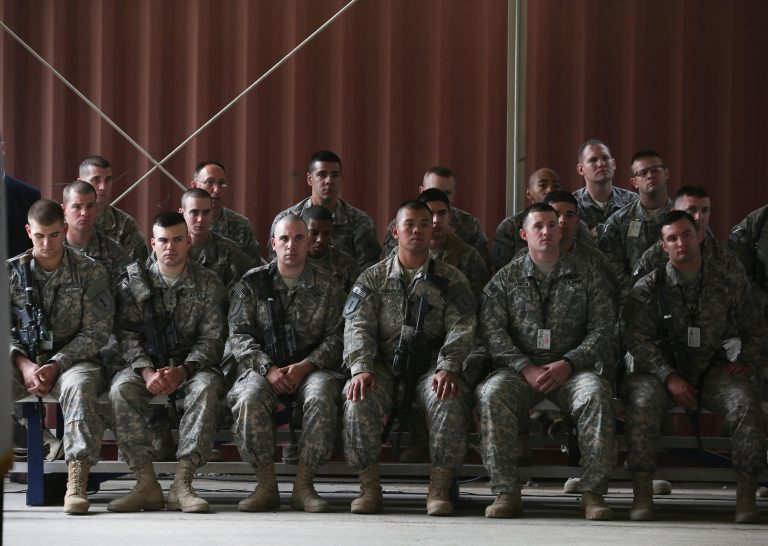 U.S. troops listen to U.S. Secretary of Defense Chuck Hagel speak at Baghdad International Airport, in Baghdad, Iraq, Tuesday, Dec. 9, 2014.Â 