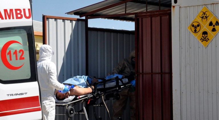 A suspected chemical attack in a town in Syria's rebel-held northern Idlib province killed dozens of people on Tuesday. (DHA-Depo Photos via AP)