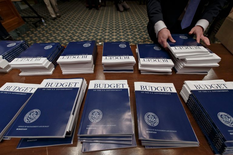 The federal $486 billion in fiscal year 2014, the Congressional Budget Office estimated Wednesday, the lowest total budget shortfall since 2008. (AP/J. Scott Applewhite)
