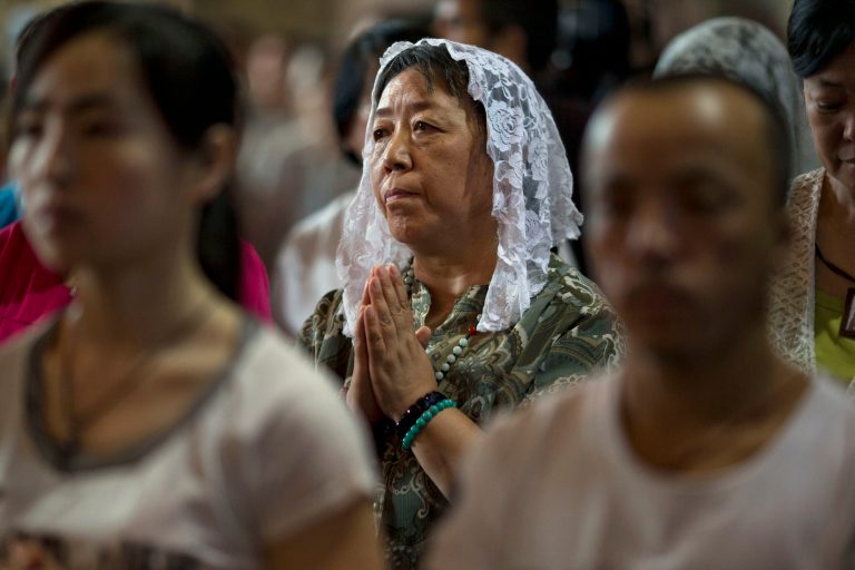 Faithfuls take part in a mass at the 400-year-old Cathedral of the Immaculate Conception in Beijing, China, Friday, Aug. 15, 2014. Chinese Catholics on Friday cheered Pope Francisâ visit to neighboring South Korea, saying they hoped his trip to their region would help end the estrangement between Beijing and the Vatican. However, Chinaâs entirely state-run media imposed a virtual news blackout on his visit, ensuring the public at large would know little about Francisâ activities. (AP Photo/Ng Han Guan)