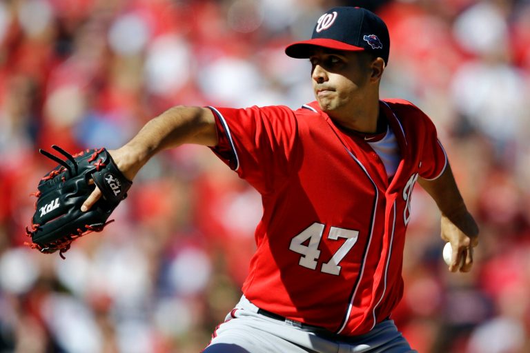 Washington Nationals starting pitcher Gio Gonzalez throws during the first inning in Game 1 of baseball's National League division series against the St. Louis Cardinals, Sunday, Oct. 7, 2012, in St. Louis. (AP Photo/Jeff Roberson)