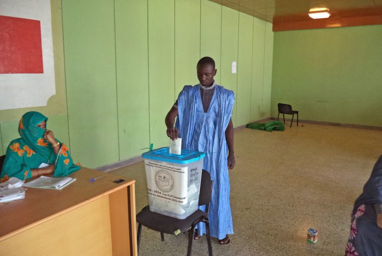 A man casts his ballot during elections held in the city of  Nouakchott , Mauritania, Saturday, June 21, 2014. Mauritanians lined up to elect a head of state Saturday, in polls expected to be won by acting president Mohamed Ould Abdel Aziz. The National Forum for Democracy and Unity, a grouping of Mauritania's main opposition parties, is boycotting the election, accusing 