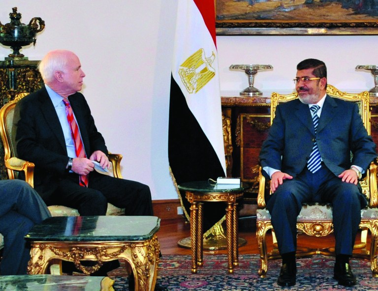 In this image released by the Egyptian Presidency, Egyptian President Mohammed Morsi, right, meets with Republican Sen. John McCain, at the Presidential Palace in Cairo, Egypt, Wednesday, Jan. 16, 2013. Morsi met with McCain in Cairo on Wednesday, for a visit expected to last three days. The meeting comes after the Obama administration on Tuesday gave a blistering review of remarks that the Egyptian President made almost three years ago about Jews and called for him to repudiate what it called unacceptable rhetoric. (AP Photo/Egyptian Presidency)
