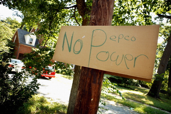 SILVER SPRING, MD - JULY 02:  A hand-written sign about local power company Pepco hangs on a pole in a residential neighborhood July 2, 2012 in Silver Spring, Maryland.  About 445,000 businesses and households in the metropolitan area surrounding the nation's capital remain without electricity three days after a deadly storm ripped a path from Illinois to the Mid Atlantic region. Almost 40-percent of Pepco customers in Montgomery County, just north of the District of Columbia, are still without electricity and the power company does not expect to have full service restored until Friday.  (Photo by Chip Somodevilla/Getty Images)