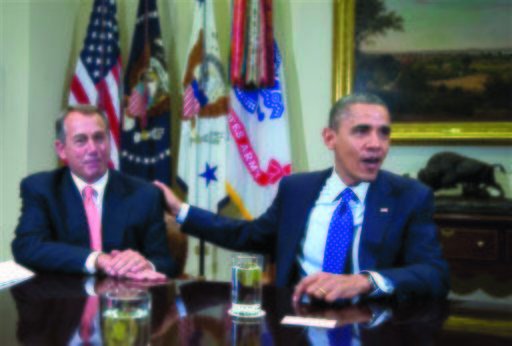 President Obama acknowledges House Speaker John Boehner of Ohio while speaking to reporters in the Roosevelt Room of the White House in Washington, as he hosted a meeting of the bipartisan, bicameral leadership of Congress to discuss the deficit and economy. (AP Photo/Carolyn Kaster, File)