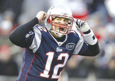 Winslow Townson/Getty Images
Patriots quarterback Tom Brady's 5,235 yards, 105.6 passing rating and 39 touchdowns ranked in the top four in the NFL this season.