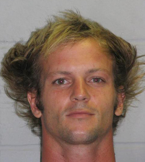 This undated photo provided by the New Jersey State Police shows Corey Pohan, of Bergenfield, N.J. Pohan, who was allegedly seen on cell phone video striking and seriously injuring a man in New York City on Tuesday, July 8, tried to escape from New York City detectives on Wednesday, July 9, 2014, who were transporting back to New York to face charges. Police say he was found hiding on the roof of a New Jersey Turnpike toll plaza and charged with criminal trespassing. Charges in New York were pending. (AP Photo/New Jersey State Police)