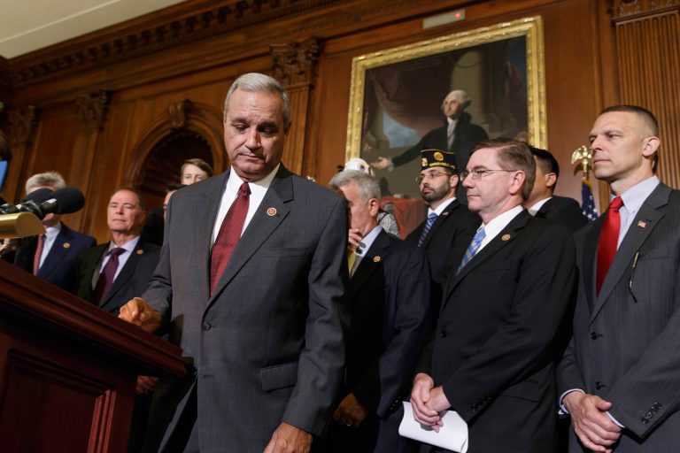 Surrounded by veterans and GOP House members, Rep. Jeff Miller, R-Fla., left, chairman of the House Committee on Veterans' Affairs, finishes a statement calling for reforms in the wake of gross mismanagement and misconduct at VA hospitals, at the Capitol in Washington, Thursday, May, 29, 2014. (AP Photo/J. Scott Applewhite)