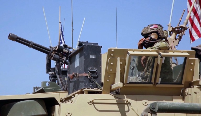 Roughly 900 U.S. troops have been deployed to Syria to help allied forces as they prepare to take back Raqqa, the Islamic State's de-facto capital. (AP Photo via APTV)