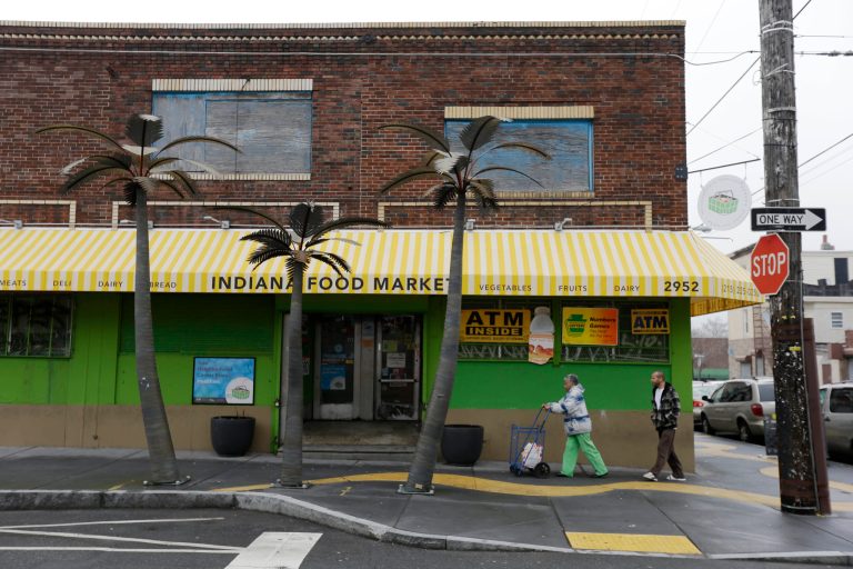Customers walk to the the Indiana Food Market in Philadelphia. (AP/Matt Rourke)
