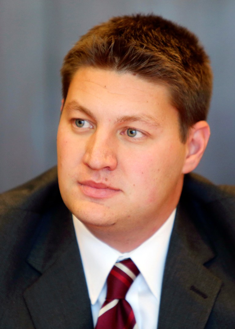 In this Sept. 29, 2014 photo, Micah Kamrass, Democratic candidate for the 28th Ohio House District, is interviewed by the Cincinnati Enquirer editorial board. Kamrass, a former student body president at Ohio State, is competing against Cincinnati-area attorney Jonathan Dever to represent a southwestern Ohio district left open as state Rep. Connie Pillich runs for state treasurer. (AP Photo/Cincinnati Enquirer, Liz Dufour)