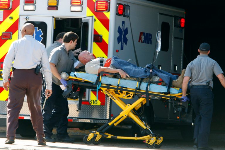 A patient believed to be one of the National Guardsmen injured near the naval base in Millington, Tenn., was taken to The Med in Memphis, Tenn., early Thursday afternoon. Two ambulances arrived carrying two injured men shortly after the shooting occurred. (AP Photo/The Commercial Appeal, Karen Pulfer Focht)