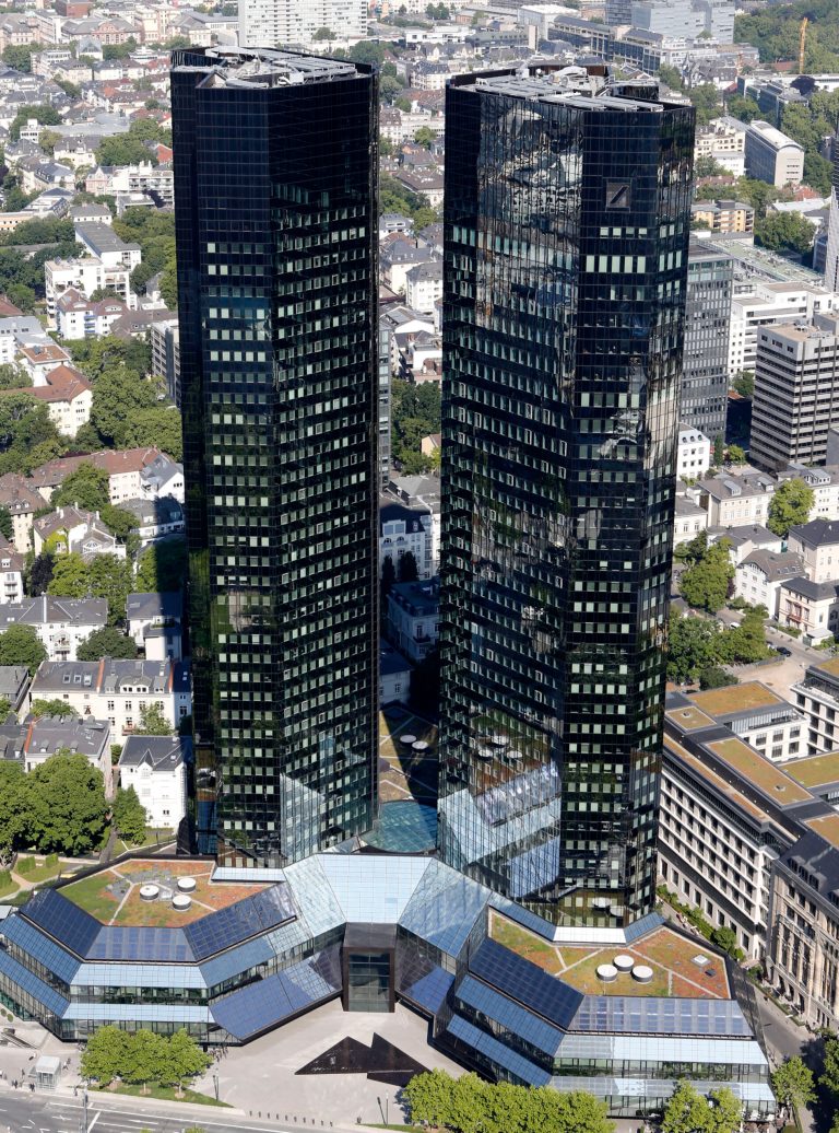 Deutsche Bank headquarters in Frankfurt, Germany, photographed Monday, May 19, 2014. Deutsche Bank AG says raising 8 billion euros (US $11 billion) in new capital from investors will strengthen its finances as it faces tighter regulation and uncertain costs from litigation.  (AP Photo/Michael Probst)