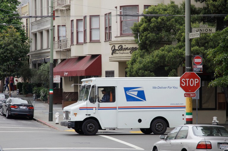 The Postal Service delivers to 155 million residences and businesses six and increasingly seven days a week, providing them with the industrial world's most affordable delivery network. (AP Photo/Eric Risberg)