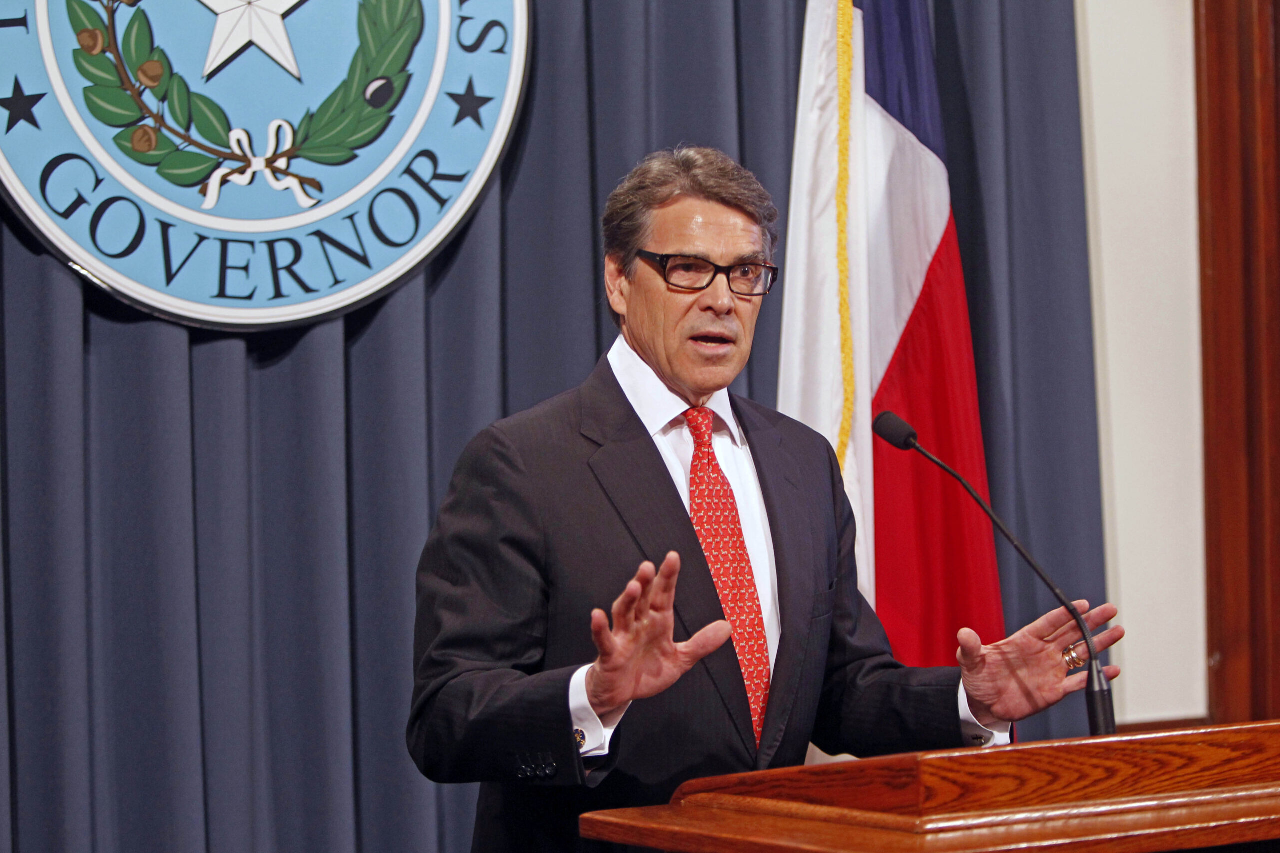 Supporters cheer Rick Perry as he is booked at Texas jail
