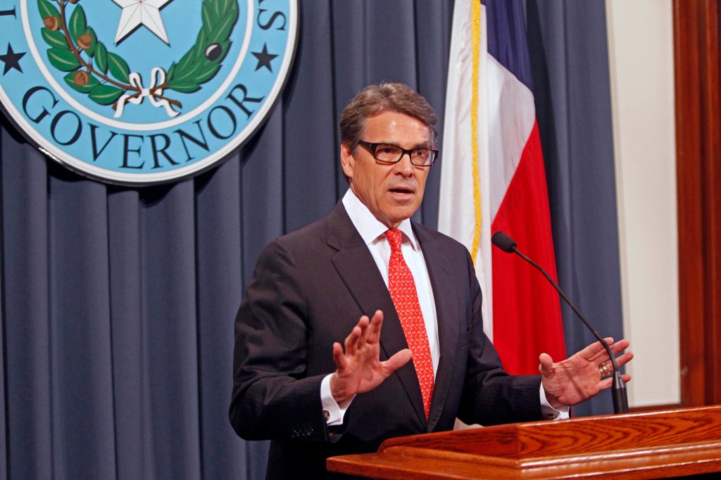 Supporters cheer Rick Perry as he is booked at Texas jail