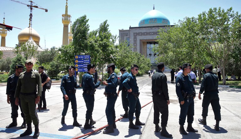 Police officers control the scene around of shrine of late Iranian revolutionary founder Ayatollah Khomeini. (AP Photo/Ebrahim Noroozi)