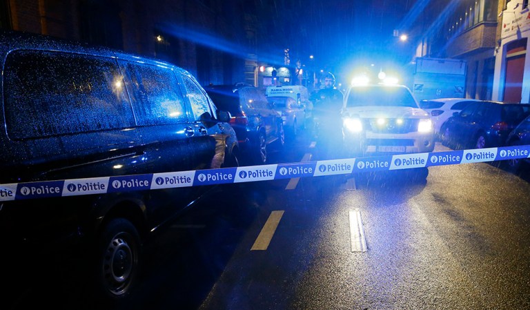 Law enforcement is holding six people following military-style raids in the heart of Brussels. (AP Photo/Alastair Grant)