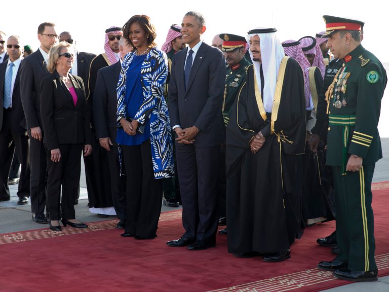 President Obama and first lady Michelle Obama stand with new Saudi King Salman bin Abdul Aziz they arrive on Air Force One at King Khalid International Airport, in Riyadh, Saudi Arabia, Tuesday, Jan. 27, 2015. (AP Photo/Carolyn Kaster)