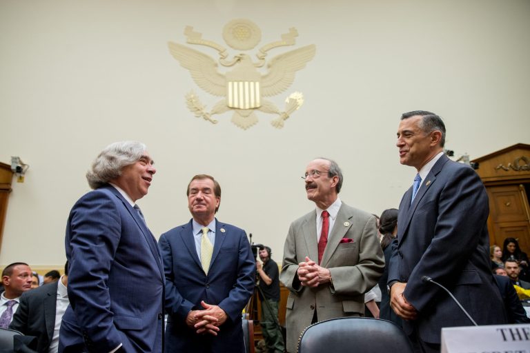 From left, Secretary of Energy Ernest Moniz, Chairman Rep. Ed Royce, R-Calif., Ranking Member Rep. Eliot Engel, and Rep. Darrell Issa, R-Calif. speak together before a House Foreign Affairs Committee hearing in Washington, Tuesday, July 28, 2015, on the Obama administration's case for the Iran Nuclear Agreement. (AP Photo/Andrew Harnik)