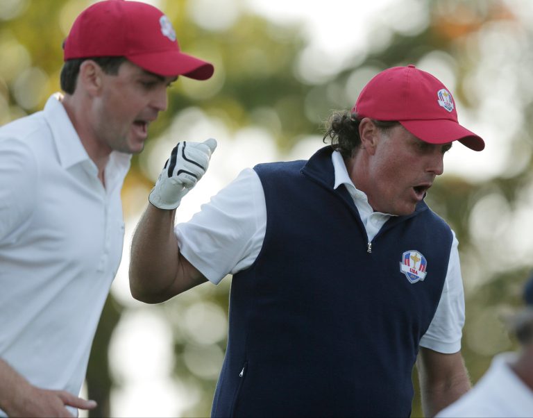USA's Keegan Bradley, left, and Phil Mickelson react on the 17th hole during a four-ball match at the Ryder Cup PGA golf tournament Friday, Sept. 28, 2012, at the Medinah Country Club in Medinah, Ill. (AP Photo/Charlie Riedel)