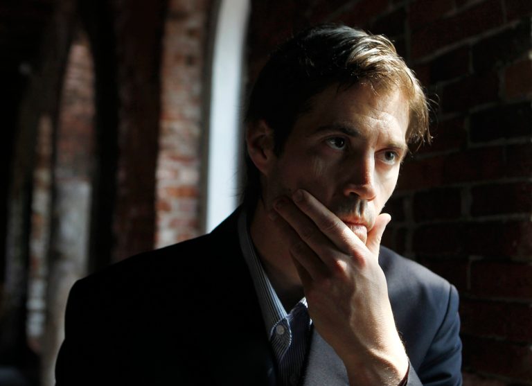 FILE - In this Friday, May 27, 2011, file photo, journalist James Foley responds to questions during an interview with The Associated Press, in Boston. A video by Islamic State militants that purports to show the killing of Foley by the militant group was released Tuesday, Aug. 19, 2014. Foley, from Rochester, N.H., went missing in 2012 in northern Syria while on assignment for Agence France-Press and the Boston-based media company GlobalPost. (AP Photo/Steven Senne, File)