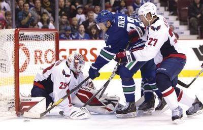 Jonathan Hayward/AP/The Canadian Press
Capitals goalie Tomas Vokoun was pulled after one period in Washington's 7-4 loss to Vancouver on Saturday night.