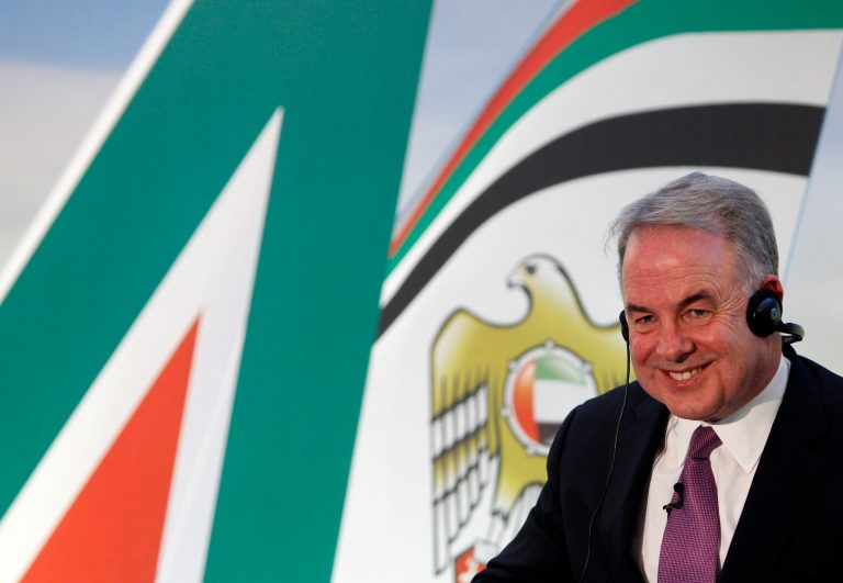 Etihad Airways CEO James Hogan smiles during a press conference in Rome, Friday, Aug. 8, 2014. Fast-growing Etihad Airways took effective control of Italy's loss-making national carrier Alitalia on Friday, injecting 560 million euros ($750 million) in a deal that will see the Gulf airline gain access to one of Europe's major markets. Etihad, which is buying a 49 percent stake in the Rome-based carrier, said Friday it will restructure Alitalia and even laid out the hope of returning it to profitability by 2017. Overall, the 1.758 billion euro deal involves 598 million in debt restructuring and 300 million euro in loans from Alitalia's smaller shareholders. (AP Photo/Riccardo De Luca