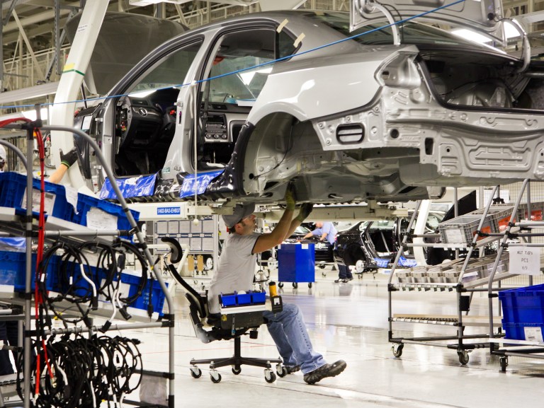An employee works on a Passat sedan at the Volkswagen plant in Chattanooga, Tenn., in July 2012. 