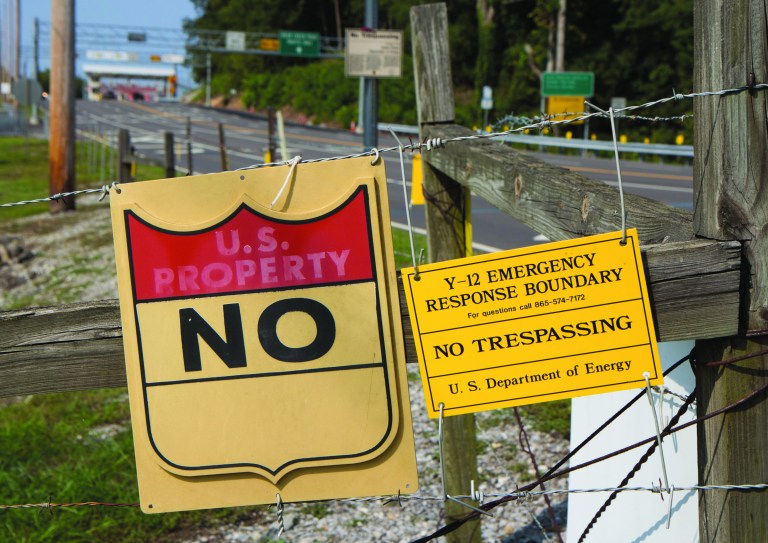 Signs warn against trespassing onto the Y-12 National Security Complex in Oak Ridge, Tenn., on Friday, Aug. 17, 2012. The plant recently resumed operations put on hold after three anti-war protesters, including an 82-year-old nun, cut their way through three fences and spray-painted slogans on the wall of a weapons-grade uranium facility. (AP Photo/Erik Schelzig)