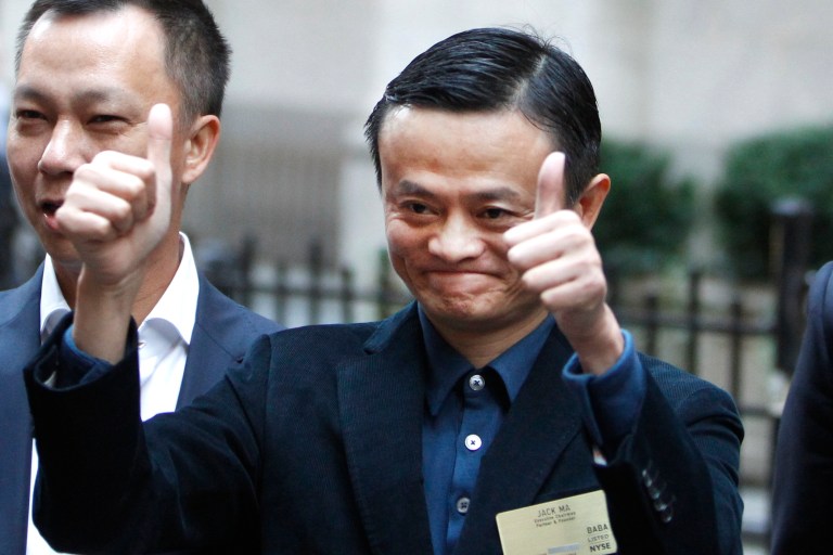 Alibaba founder Jack Ma poses for photographers outside the New York Stock Exchange prior to his company's initial public offering, Friday, Sept. 19, 2014, in New York. The Chinese e-commerce giant goes public Friday in a record-busting share sale. (AP Photo/Jason DeCrow)
