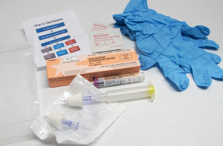 In this May 13, 2015 photo, the contents of a drug overdose rescue kit is seen at a training session in Buffalo, N.Y., on how to administer naloxone, which reverses the effects of heroin and prescription painkillers. The kits are being provided to community members in Erie County who seek training in how to recognize a potential drug overdose and administer naloxone, which reverses the effects of heroin and prescription painkillers. New York and other states have been equipping lay people, as well first responders and families of addicts, with naloxone in an effort to increase the chances it will be there when needed. (AP Photo/Carolyn Thompson)