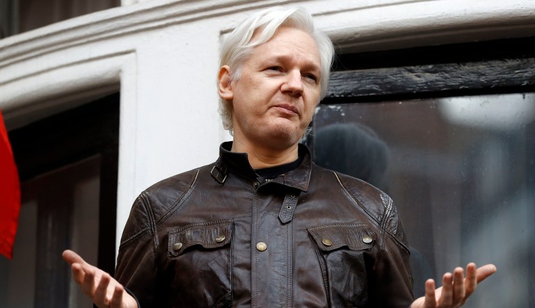 Julian Assange greets supporters outside the Ecuadorian embassy in London, Friday May 19, 2017. (AP Photo/Frank Augstein)