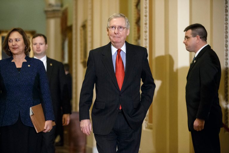 Senate Majority Leader Mitch McConnell of Ky., joined by Sen. Deb Fischer, R-Neb., left, arrives to speak with reporters after a weekly Republican policy meeting, Tuesday, Jan. 20, 2015, on Capitol Hill in Washington. (AP Photo/J. Scott Applewhite)
