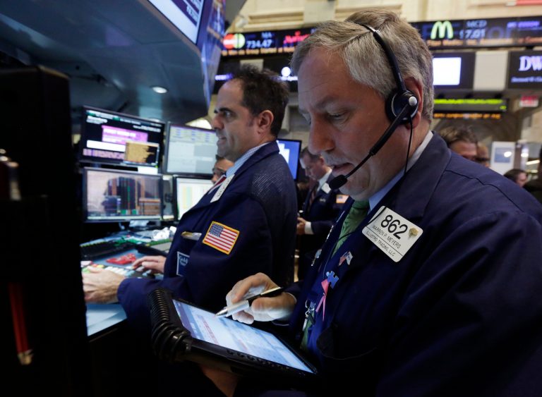 Traders work on the floor of the New York Stock Exchange on Monday. Investors this week will look for evidence that Americans are ready to start spending for the holidays. (AP Photo/Richard Drew)