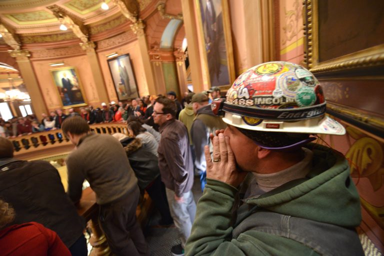   Brett Brown or Owosso, Mich., chants as Pro-union demonstrators crowd the Rotunda in Lansing, Mich., to chant Wednesday afternoon Dec. 5, 2012, in the Capitol after House and Senate Democrats said there was a possibility of 