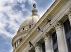 Workers rappel down Oklahoma Capitol to examine crumbling limestone